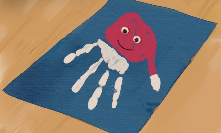 Bilden visar ett blått julkort med ett handavtryck i färgerna vit och röd.