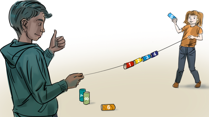 Två elever trär upp siffror på en tråd.