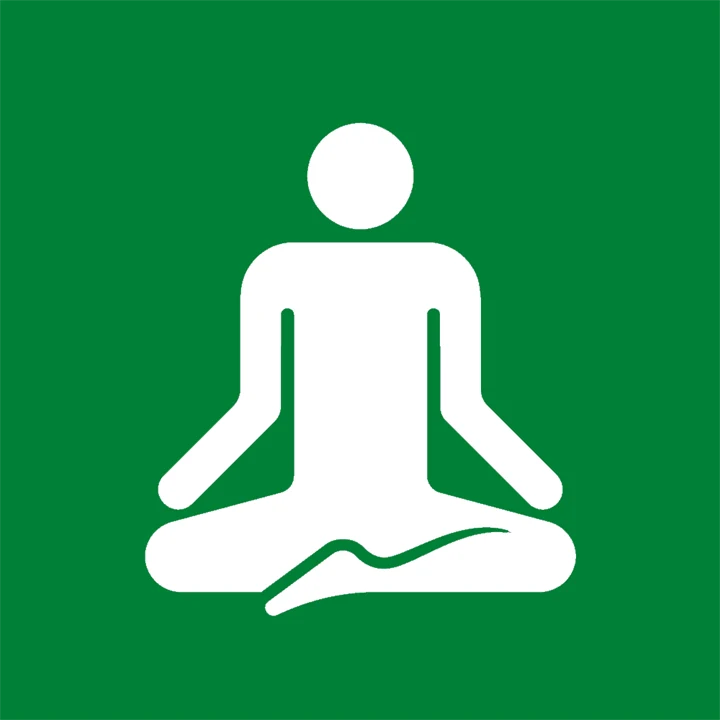 grön och vit picogrambild som föreställer en person som sitter i yogaposition